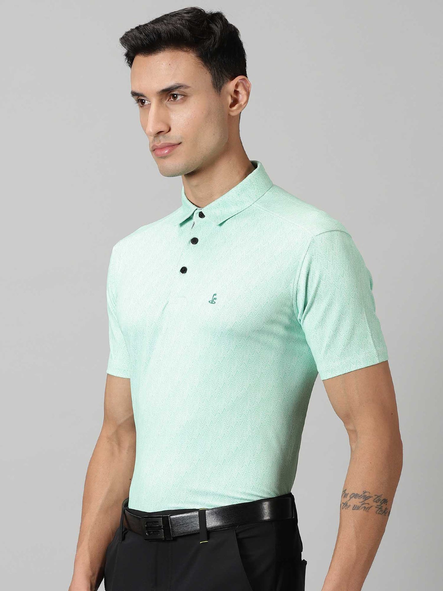Image of Inspired by the summers and winters of the OOTY GYMKHANA , THE UPHILL GOLF POLO in summer green and steel grey features special 4 X way stretch fabric. The self made collar and placket with contrasting print adds to the style quotient. The silicon detailing are placed on the front and back. From Firstcut.co