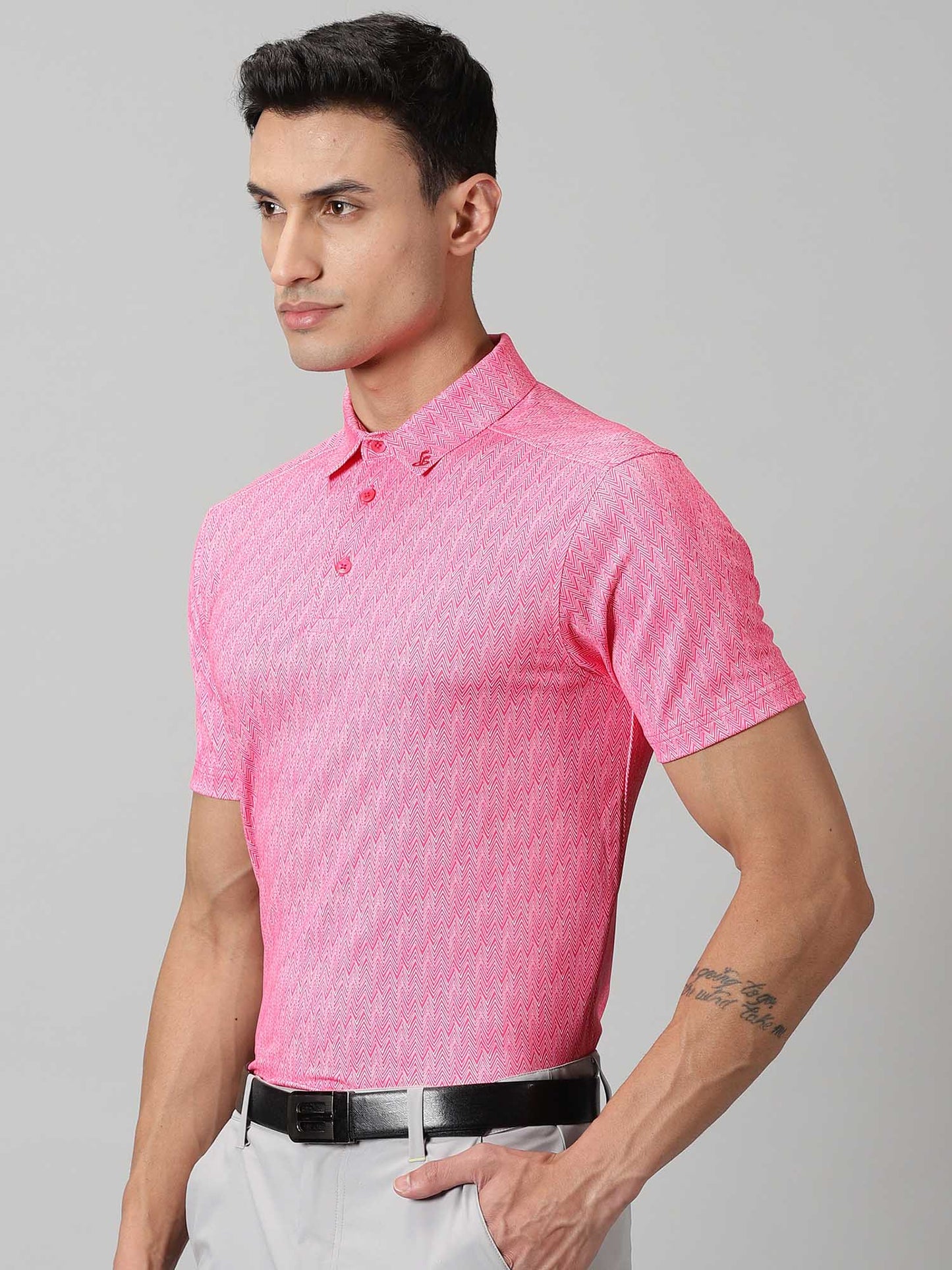 Image of Inspired by the summers and winters of the OOTY GYMKHANA , THE UPHILL GOLF POLO in pink features special 4 X way stretch fabric. The self made collar and placket with contrasting print adds to the style quotient. The silicon detailing are placed on the front and back. From Firstcut.co