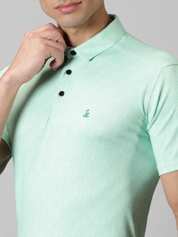 Image of Inspired by the summers and winters of the OOTY GYMKHANA , THE UPHILL GOLF POLO in summer green and steel grey features special 4 X way stretch fabric. The self made collar and placket with contrasting print adds to the style quotient. The silicon detailing are placed on the front and back. From Firstcut.co