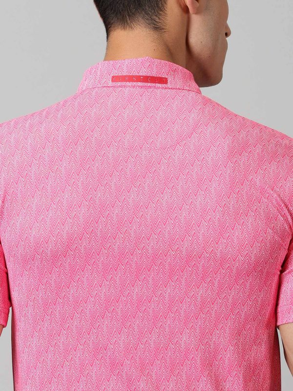 Image of Inspired by the summers and winters of the OOTY GYMKHANA , THE UPHILL GOLF POLO in pink features special 4 X way stretch fabric. The self made collar and placket with contrasting print adds to the style quotient. The silicon detailing are placed on the front and back. From Firstcut.co