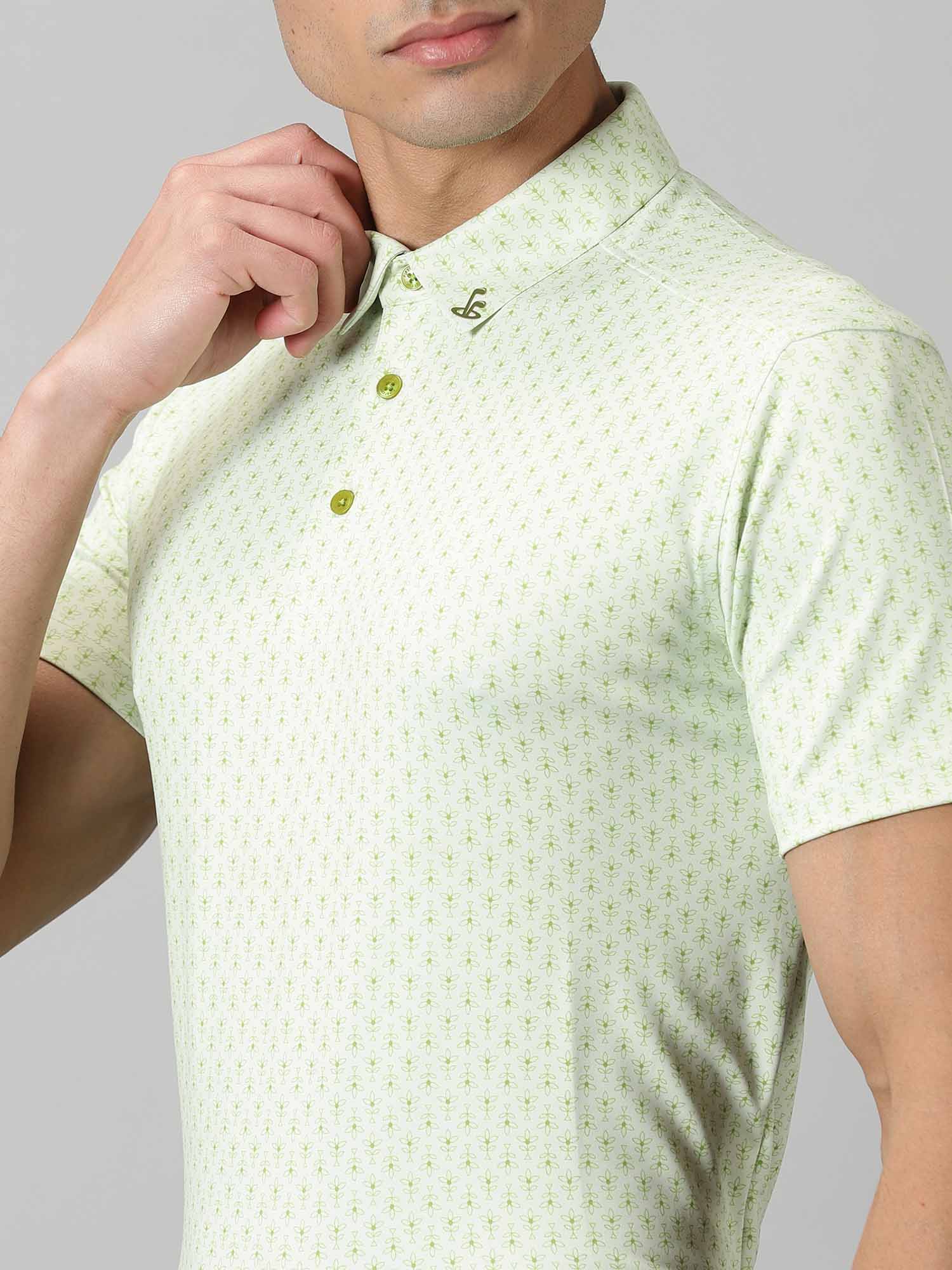 Image of All-over printed short sleeved polo with abstract plants in green, features a handmade collar. The yoke sports contrasting colour with silicon detailing on the collar tip and back. From Firstcut.co